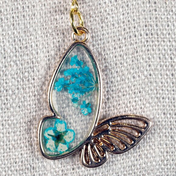 Gold Resin Butterfly with Flowers in the Wing 1 inch Earrings - Picture 1 of 3